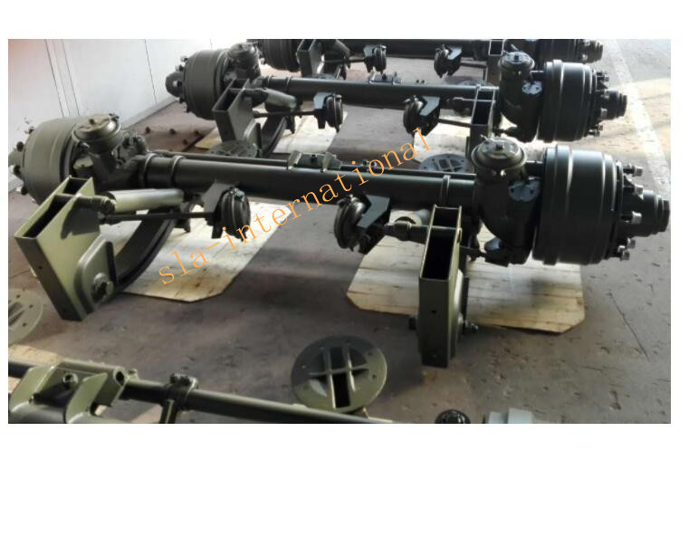 Self-steering trailer axle